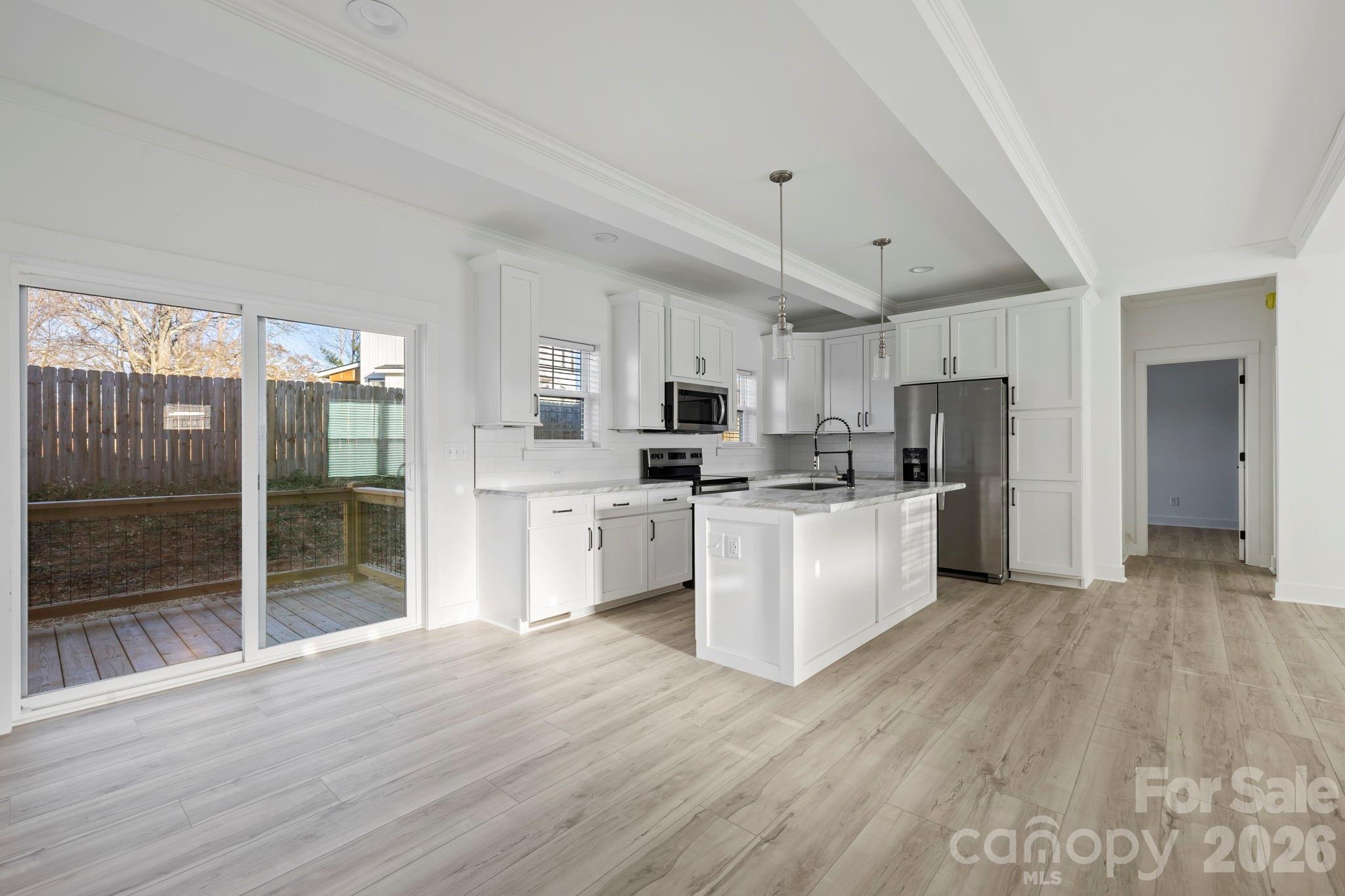 204 Southern Charm Road Arden, NC 28704 - Photo 8 of 24 a kitchen with stainless steel appliances a refrigerator sink and cabinets
