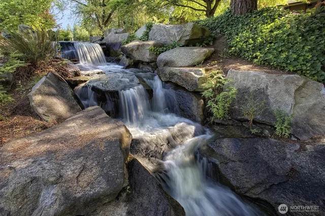 a view of a lake with a house in the background