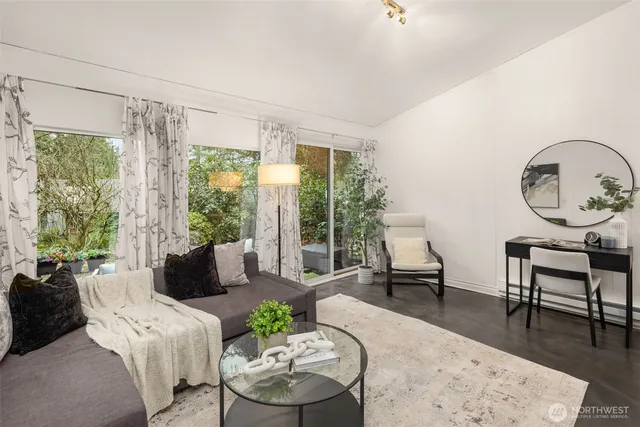 a living room with furniture and a large window