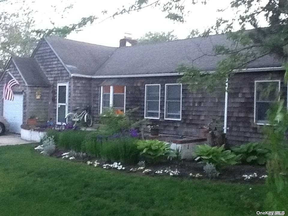 157 Blackheath Road Long Beach, NY 11561 - Photo 1 of 1 a view of a house with a yard and a garden