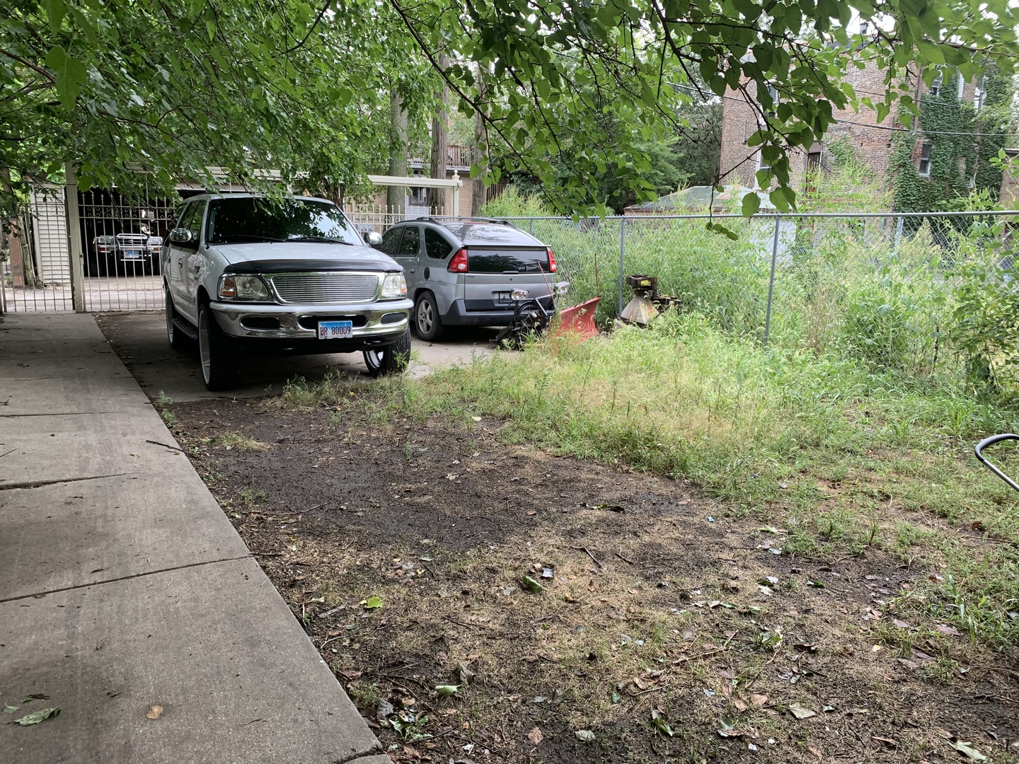 6709 South Rhodes Avenue Chicago, IL 60637 - Photo 6 of 7 a car parked in front of a house