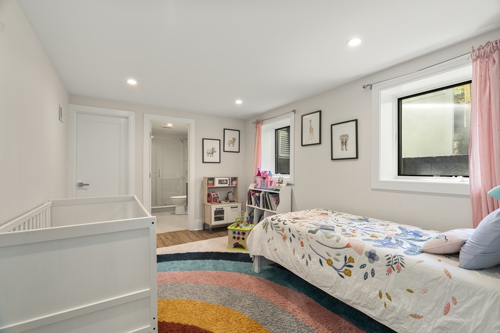 148 Kent Street, Unit 148 Brookline, MA 02446 - Photo 14 of 19 a bedroom with a bed and a couch