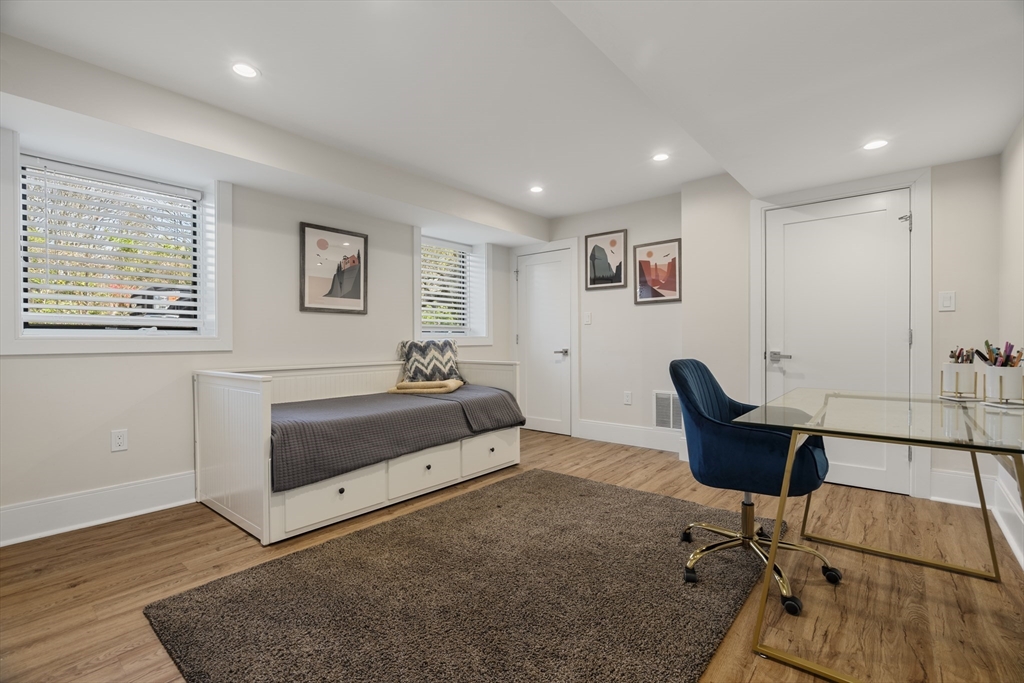 148 Kent Street, Unit 148 Brookline, MA 02446 - Photo 15 of 19 a bed room with a bed and a couch