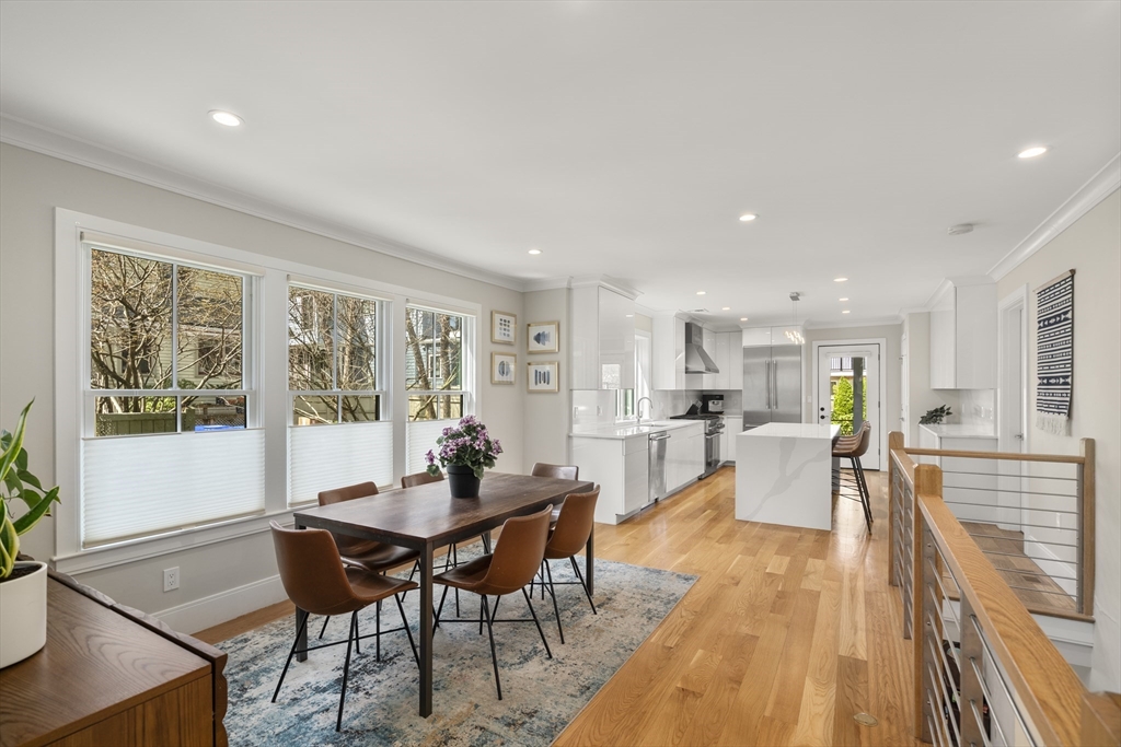 148 Kent Street, Unit 148 Brookline, MA 02446 - Photo 4 of 19 a dining room with furniture and wooden floor