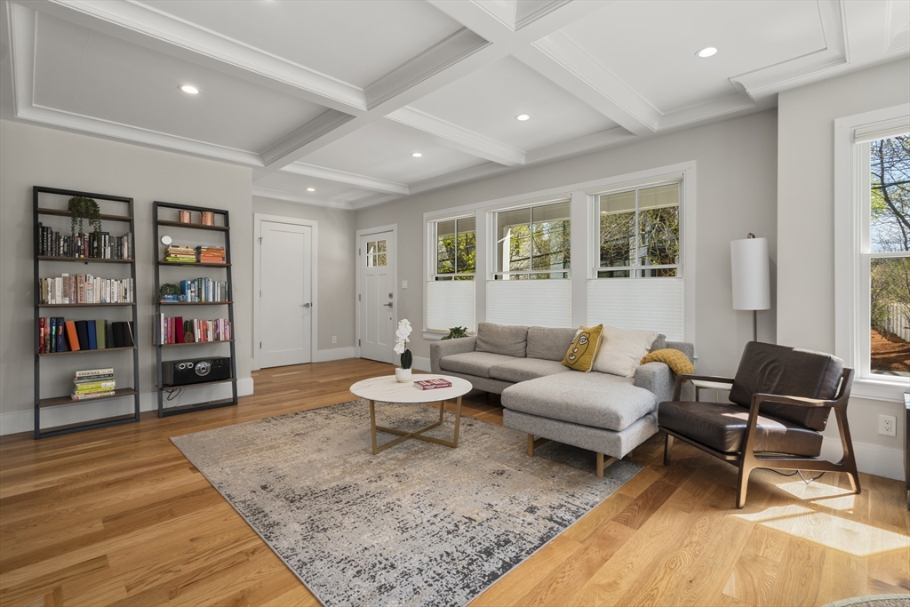148 Kent Street, Unit 148 Brookline, MA 02446 - Photo 6 of 19 a living room with furniture and wooden floor