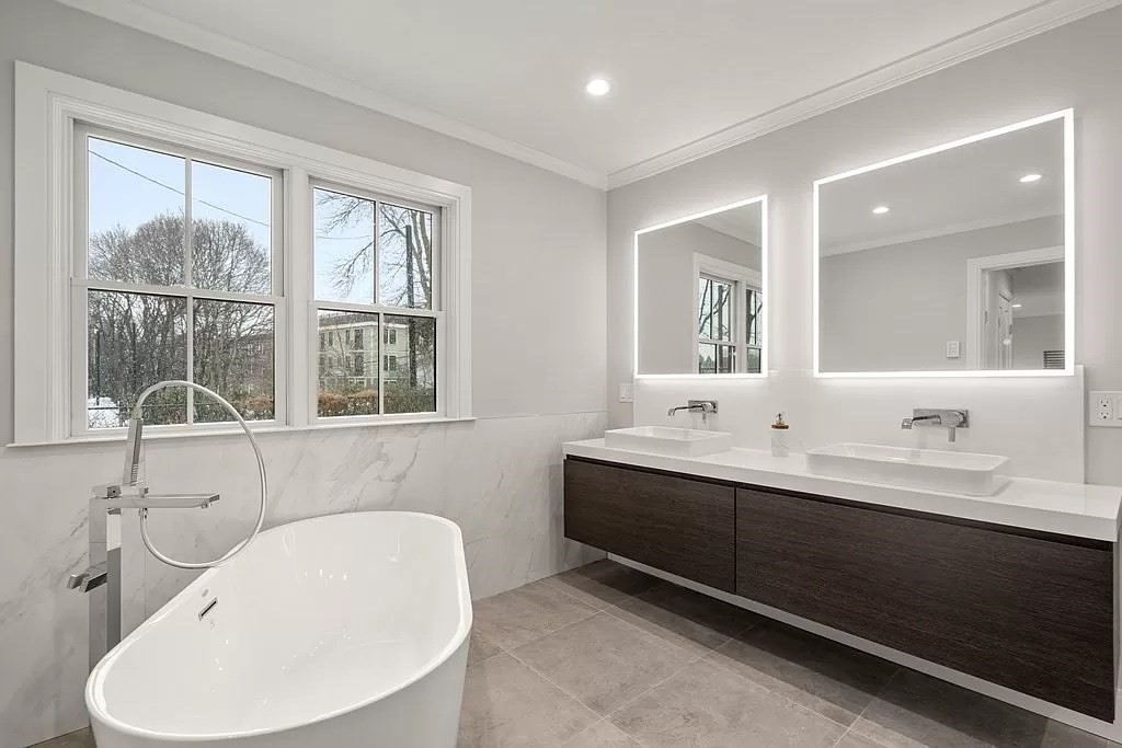 148 Kent Street, Unit 148 Brookline, MA 02446 - Photo 10 of 19 a bathroom with a double vanity sink mirror and window