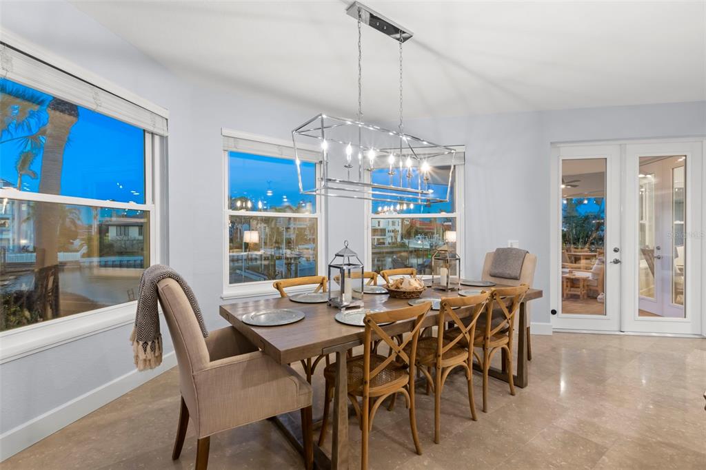 123 8th Street East Tierra Verde, FL 33715 - Photo 12 of 87 a view of a dining room with furniture window and outside view