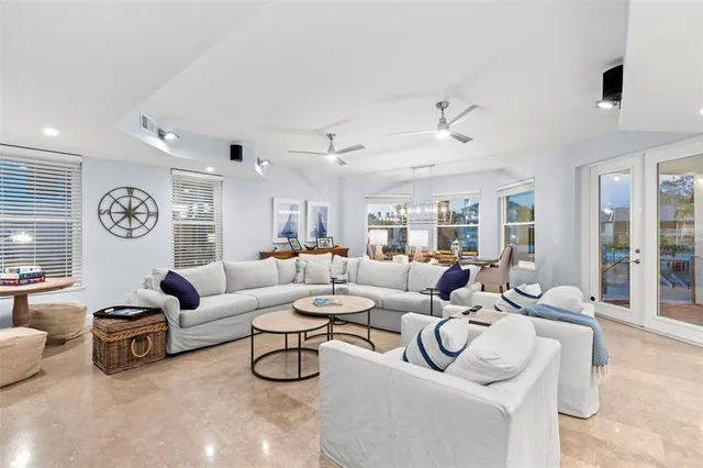 a view of a dining room with furniture and chandelier