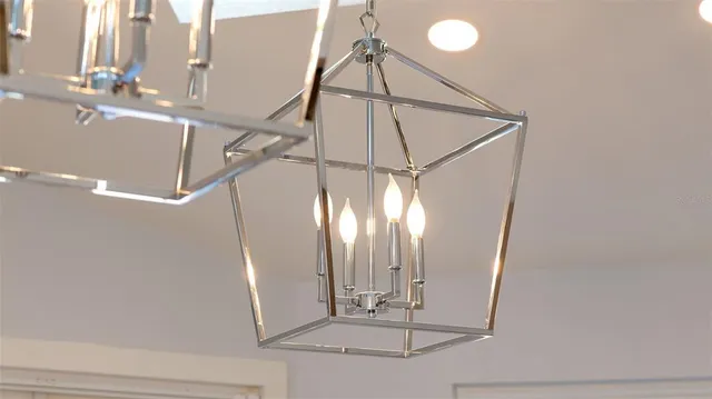 a spacious bedroom with a bed and a flat screen television