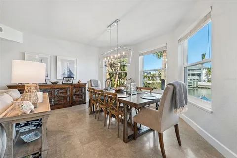 a spacious bedroom with a bed and a flat screen tv