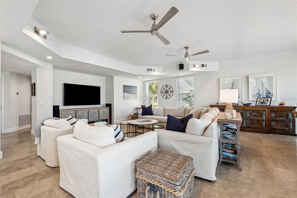 123 8th Street East Tierra Verde, FL 33715 - Photo 32 of 87 a living room with furniture and a flat screen tv