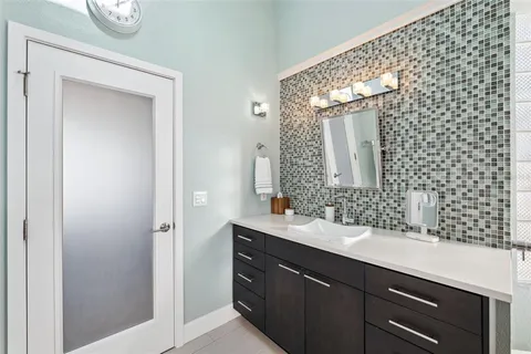 a view of a house with backyard porch and sitting area