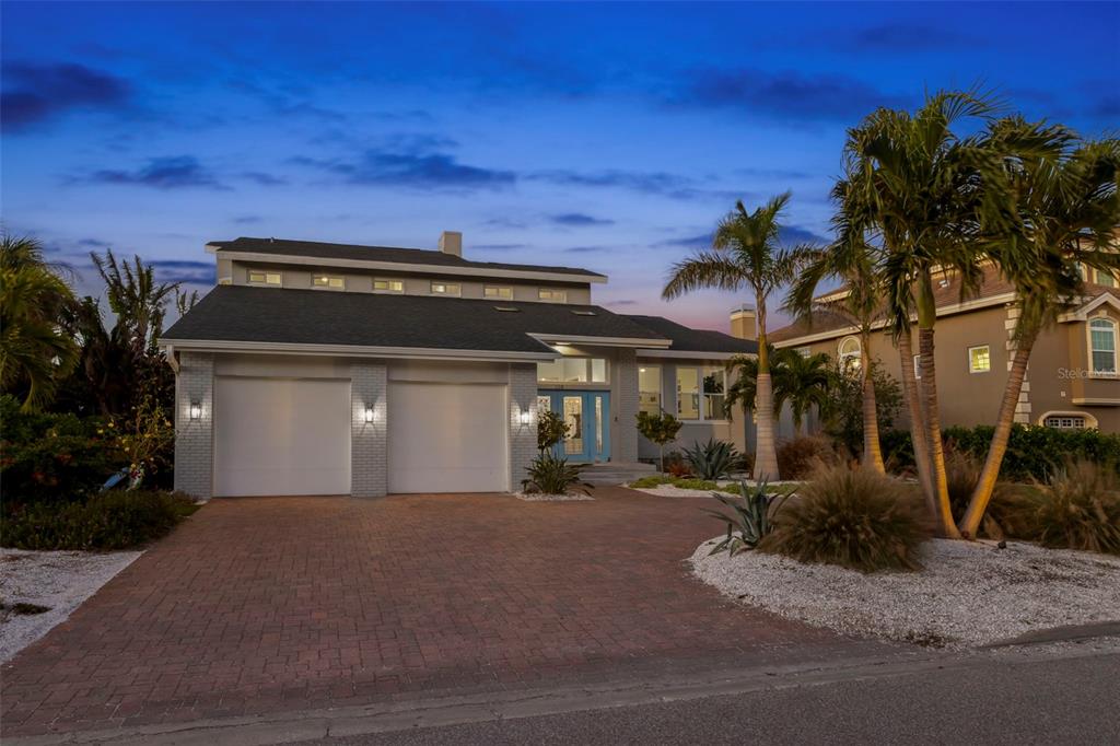 123 8th Street East Tierra Verde, FL 33715 - Photo 67 of 87 a front view of a house with a yard