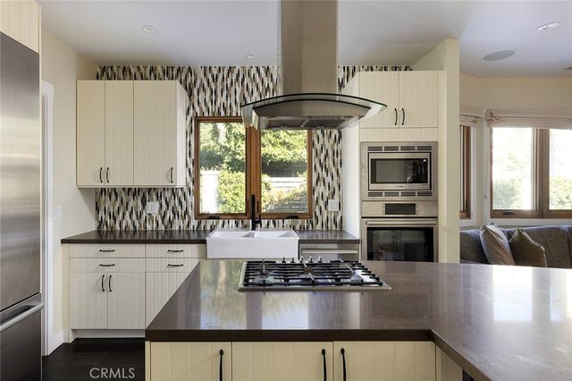 a kitchen with a stove a refrigerator and a stove