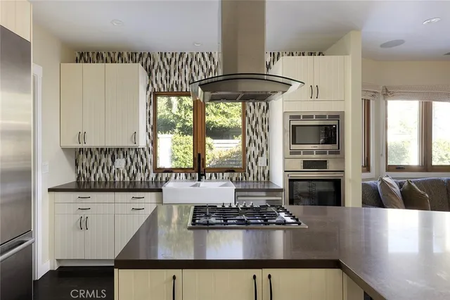 a kitchen with a stove a refrigerator and a stove