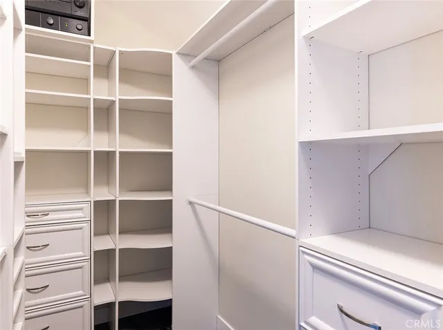 a view of an empty walk in closet