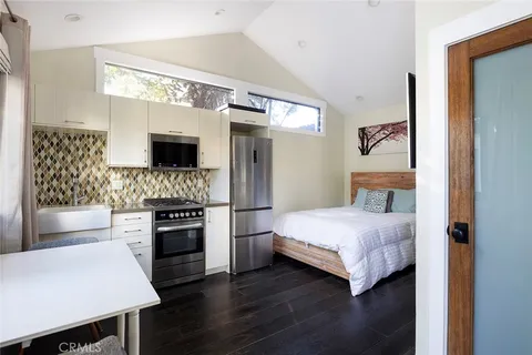 a bedroom with a bed and a fireplace