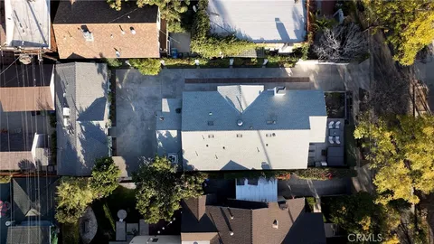 an aerial view of houses with outdoor space
