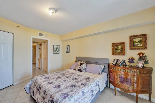 a bathroom with a granite countertop sink a mirror and a bathtub