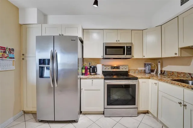 a view of a lake with tall buildings