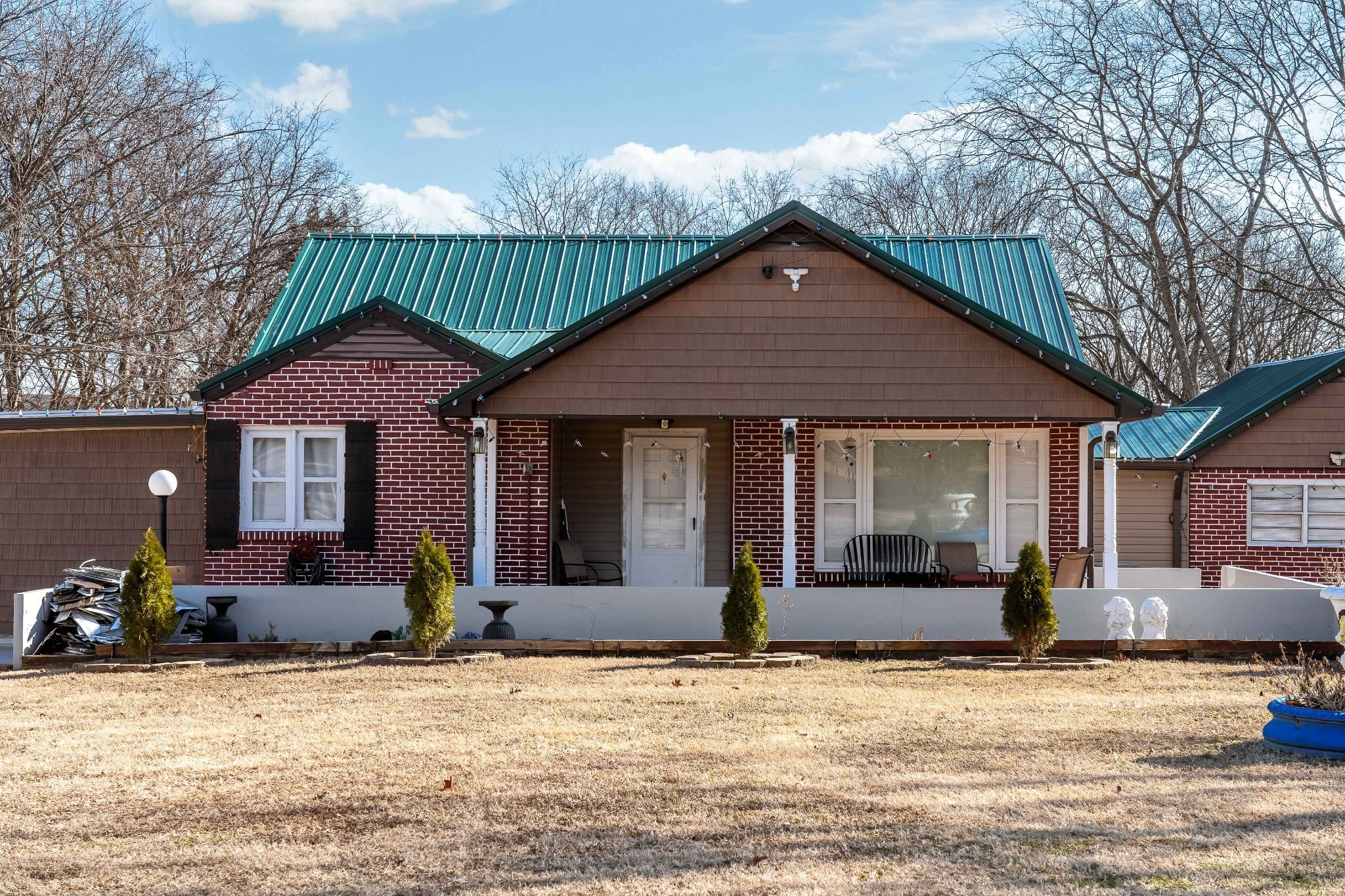 709 Florence Circle Madison, TN 37115 - Photo 2 of 39 a front view of a house with a yard and potted plants