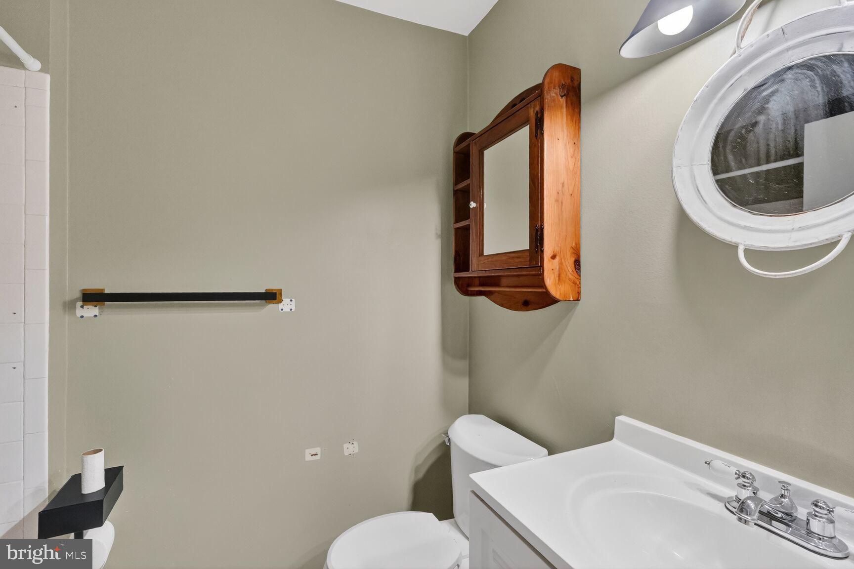 15320 Pine Orchard Drive, Unit 83C1 Silver Spring, MD 20906 - Photo 12 of 21 a bathroom with a sink and a mirror