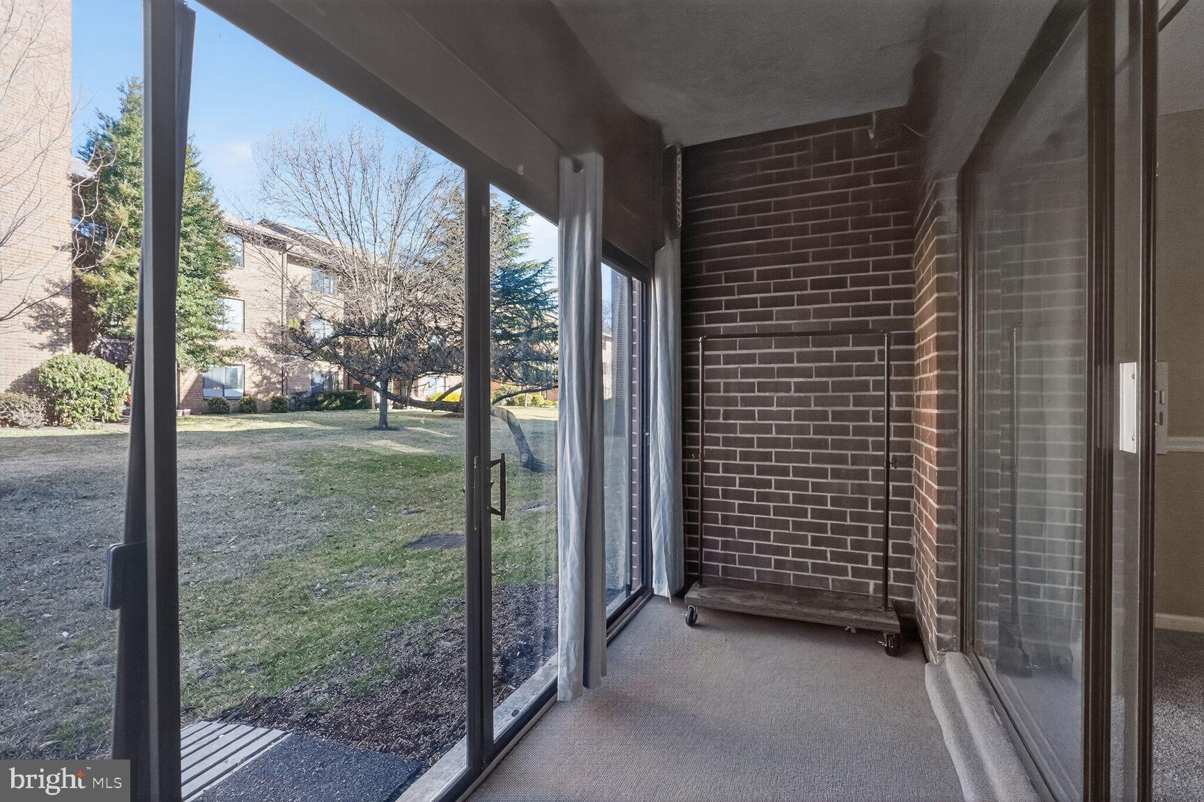 15320 Pine Orchard Drive, Unit 83C1 Silver Spring, MD 20906 - Photo 14 of 21 a view of a glass door and porch