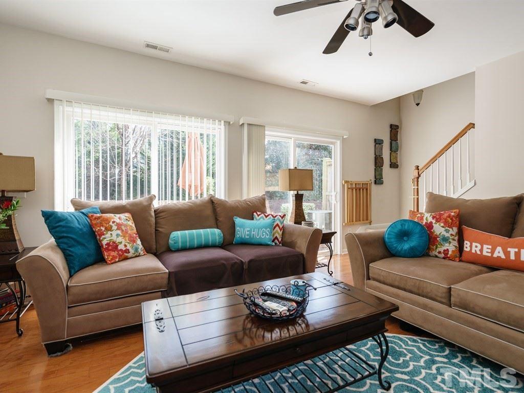 8326 Pilots View Drive Raleigh, NC 27617 - Photo 13 of 25 a living room with furniture and a large window