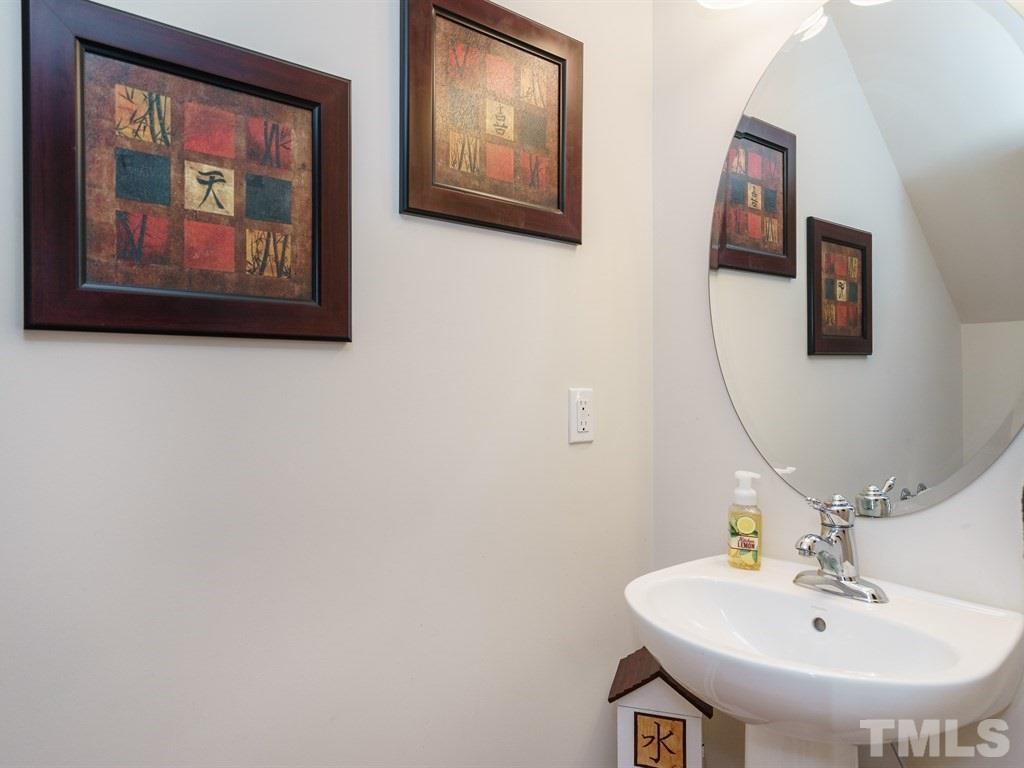 8326 Pilots View Drive Raleigh, NC 27617 - Photo 14 of 25 a bathroom with a sink and mirror
