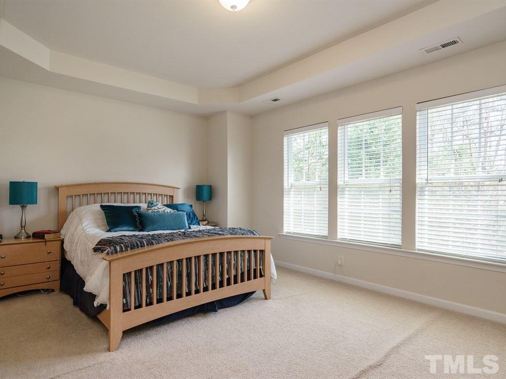 8326 Pilots View Drive Raleigh, NC 27617 - Photo 15 of 25 a bedroom with a bed and a window