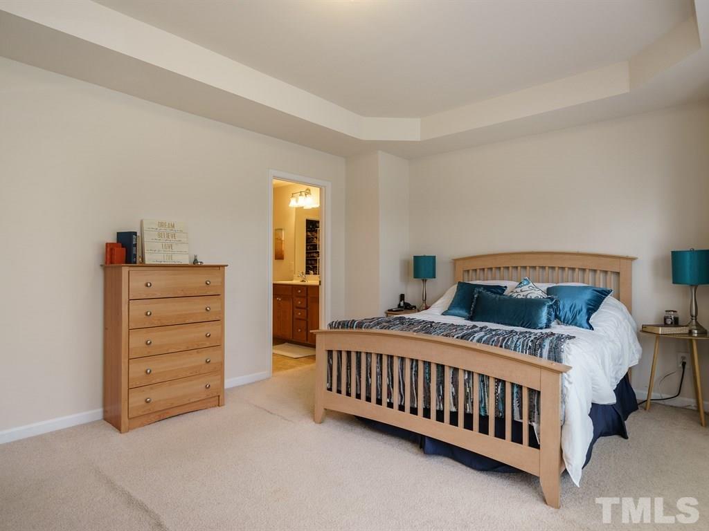 8326 Pilots View Drive Raleigh, NC 27617 - Photo 16 of 25 a bedroom with a bed and a baby crib