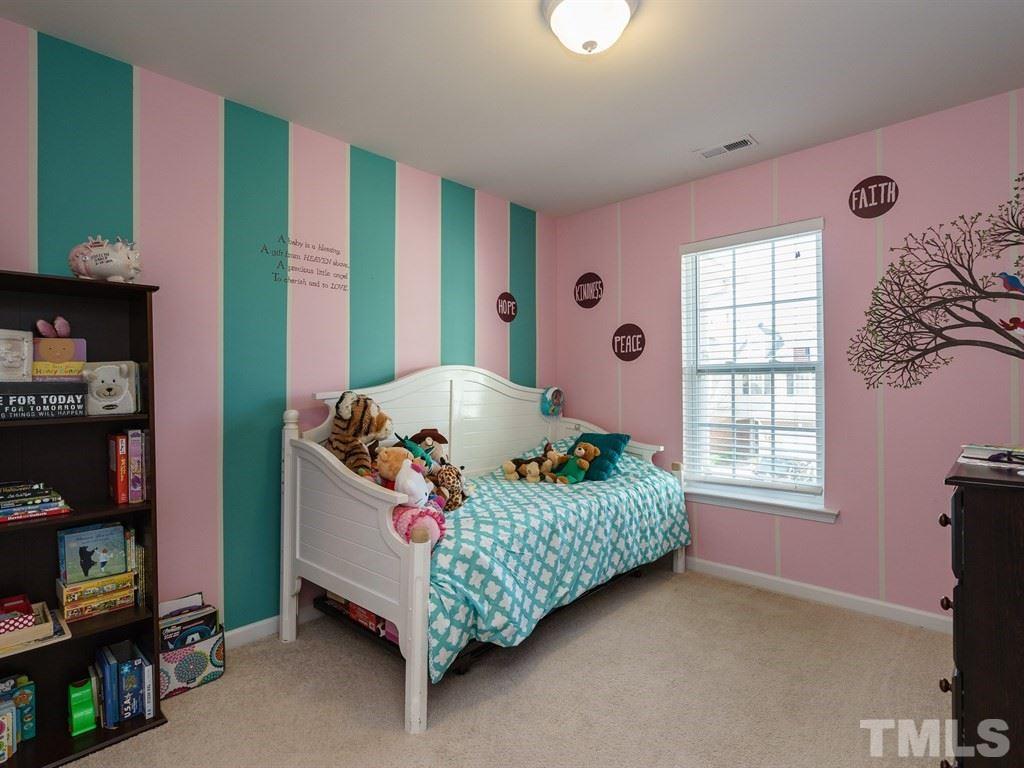 8326 Pilots View Drive Raleigh, NC 27617 - Photo 18 of 25 a bedroom with a bed and a window