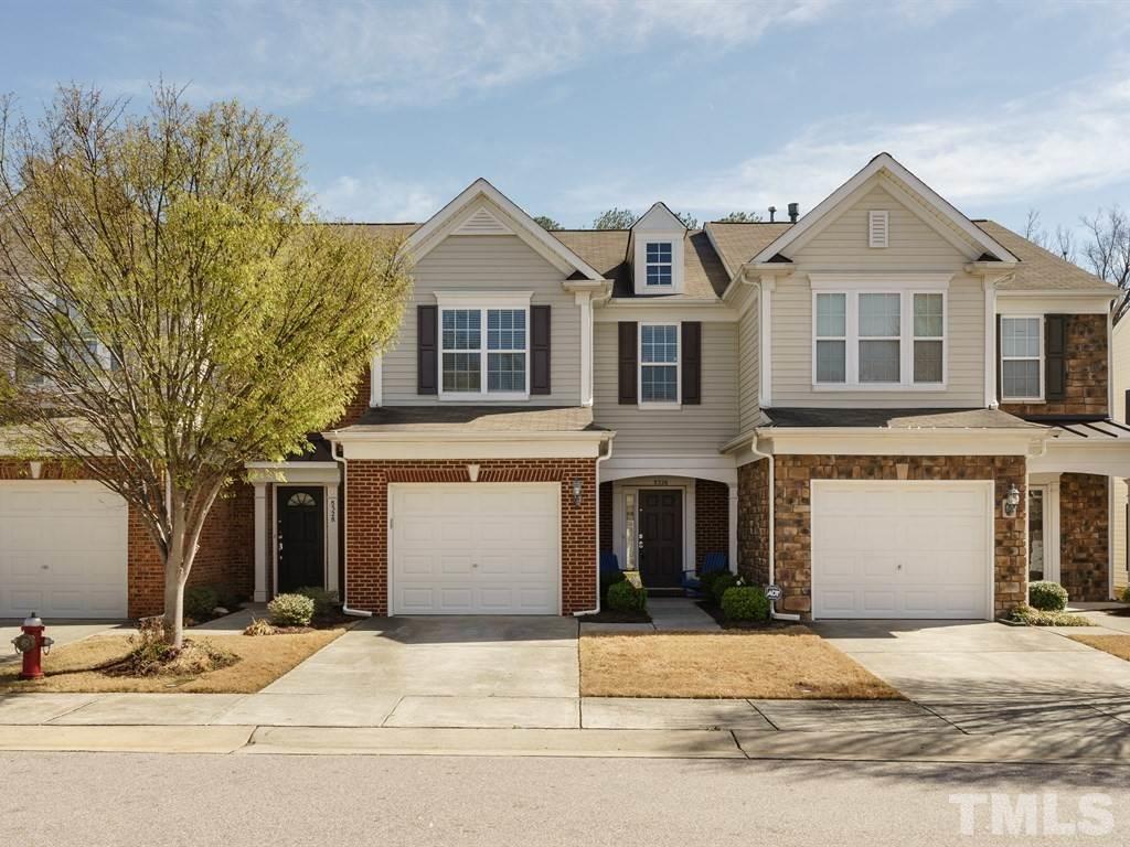 8326 Pilots View Drive Raleigh, NC 27617 - Photo 24 of 25 a front view of a house with a yard and garage