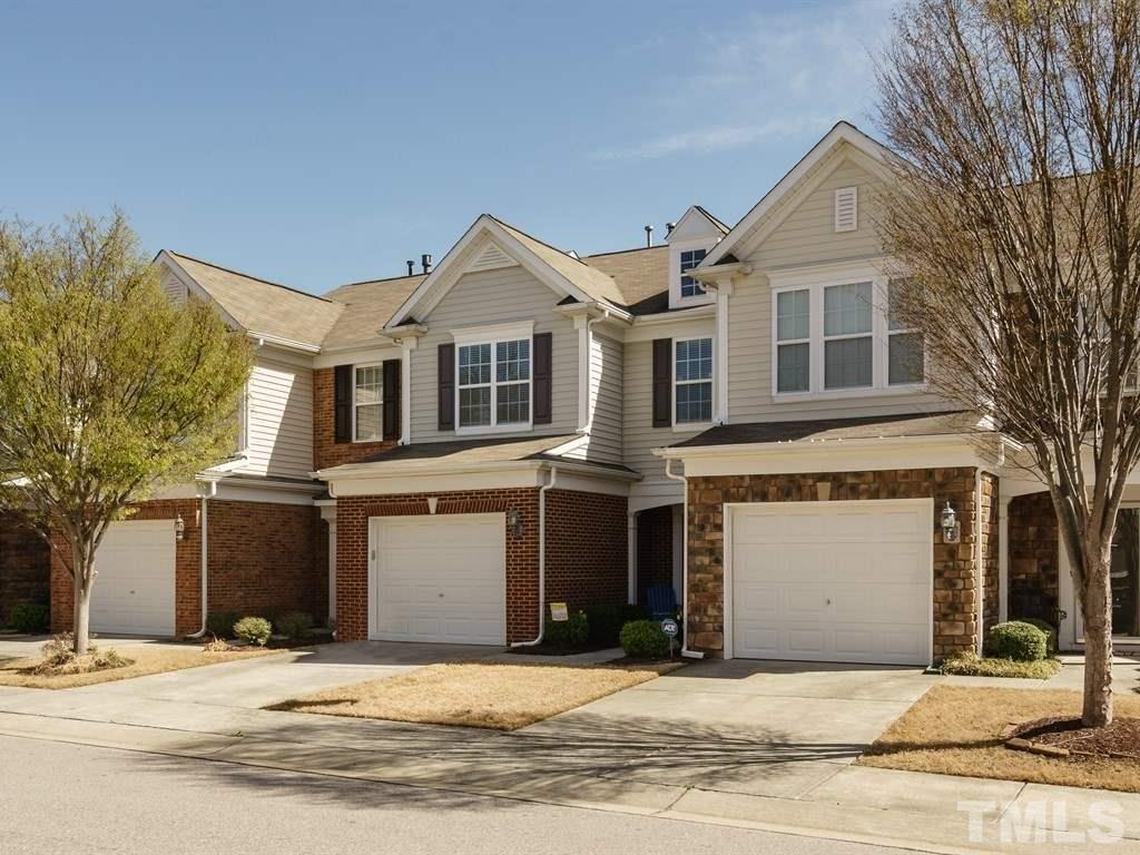 8326 Pilots View Drive Raleigh, NC 27617 - Photo 25 of 25 a front view of a house with a yard and garage
