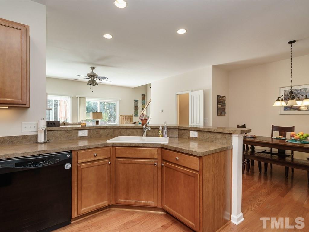 8326 Pilots View Drive Raleigh, NC 27617 - Photo 10 of 25 a kitchen with a sink and cabinets