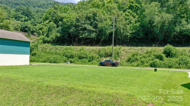 a view of a lake with a yard