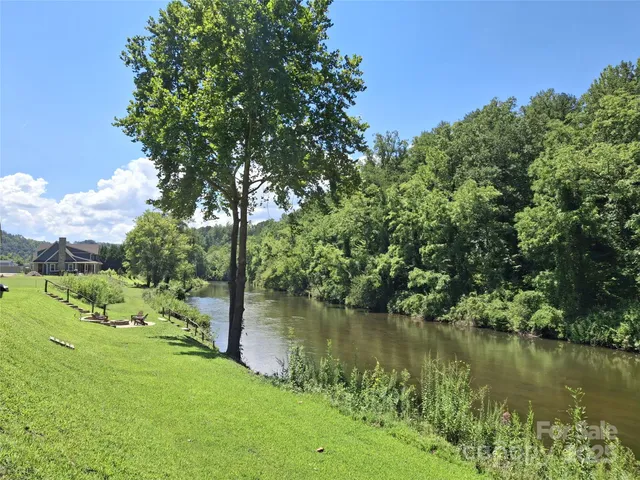 a view of a lake with a yard