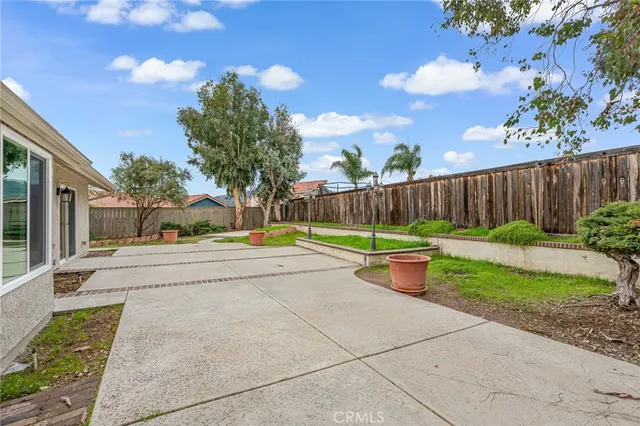 a view of a yard with potted plants