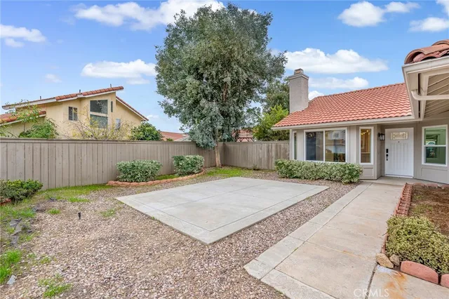 a front view of a house with yard and green space