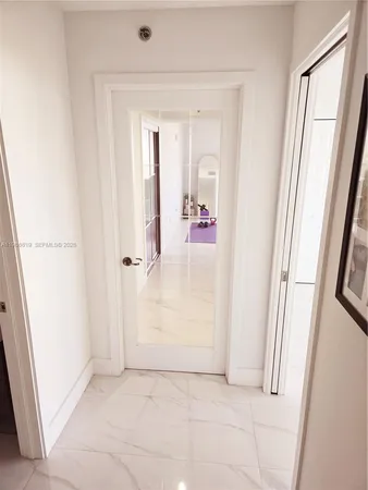 an entryway with a mirror