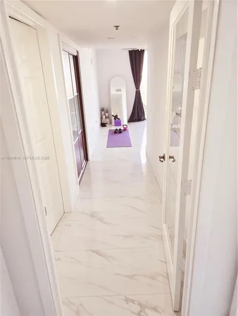 a bathroom with a sink and mirror with toilet