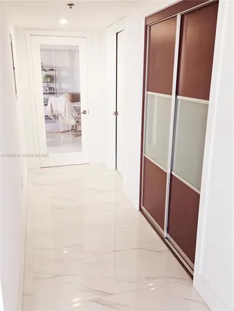 a bathroom with a shower and a mirror