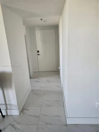 a view of hallway with a sink and a vanity