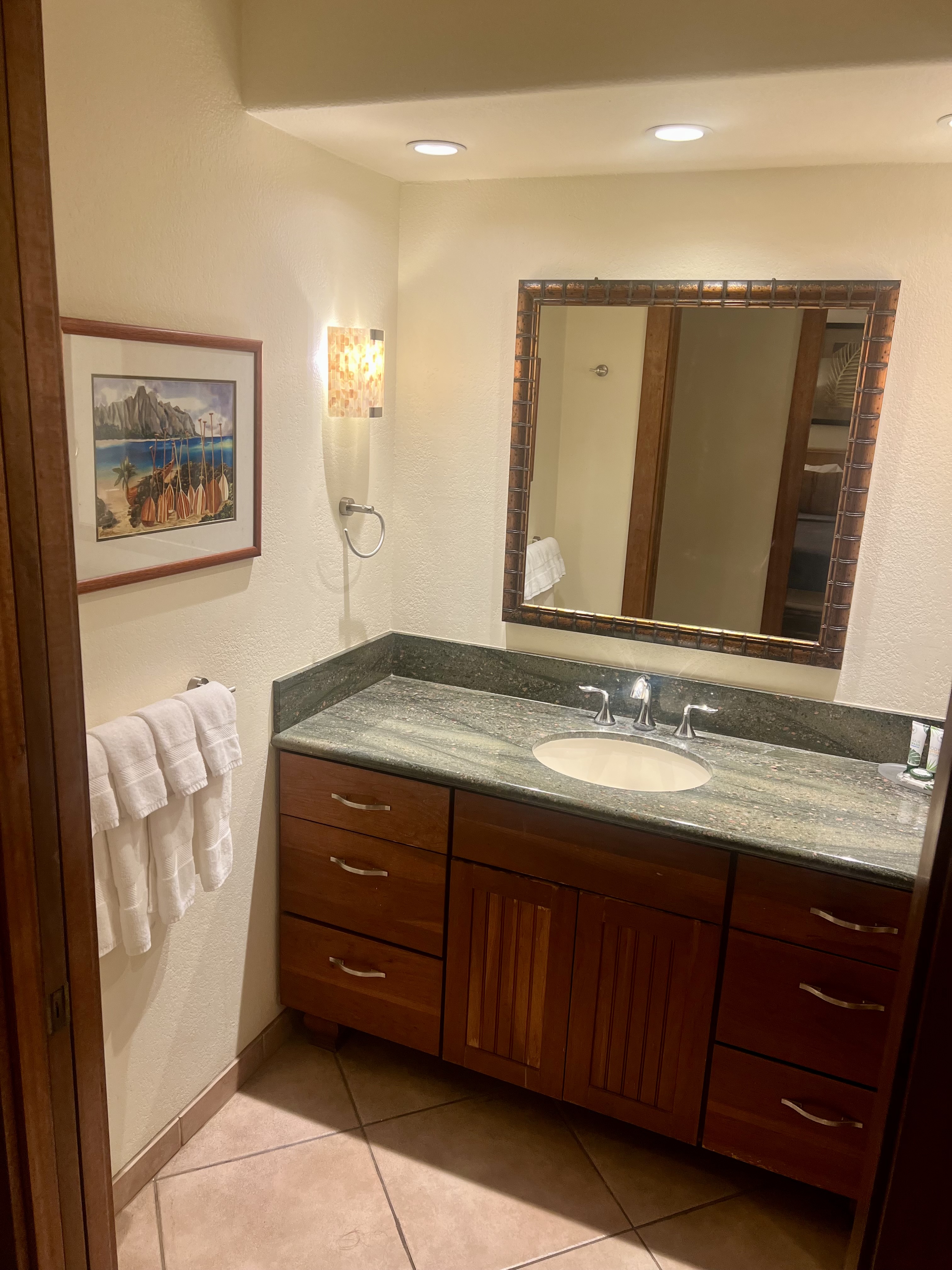 2253 Poipu Road, Unit 421 Koloa, HI 96756 - Photo 4 of 11 a bathroom with a granite countertop sink and a mirror