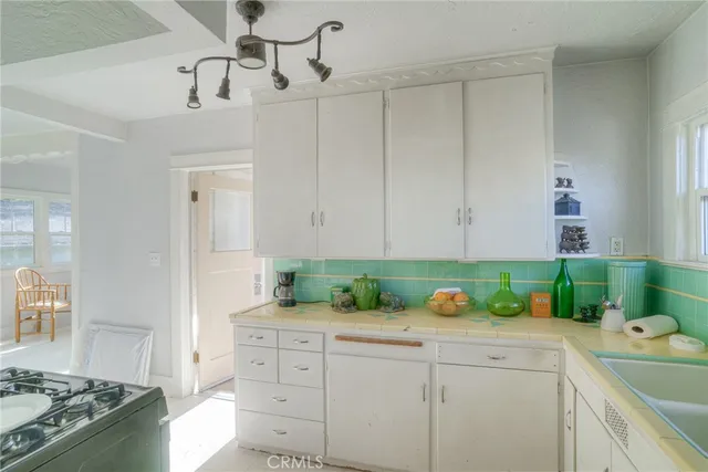 a kitchen with a cabinets and appliances