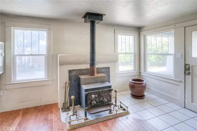 a living room with furniture a window and a fireplace