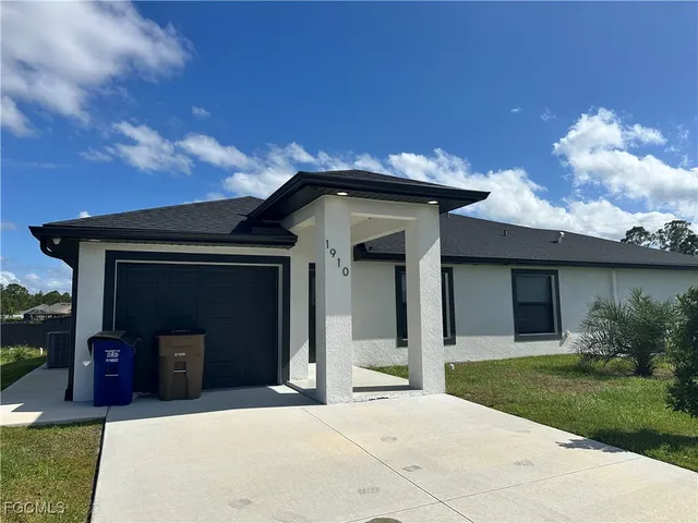 a front view of a house with yard