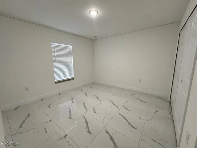 an empty room with a bench