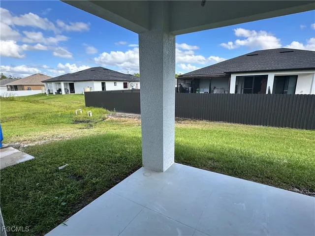a view of house with backyard