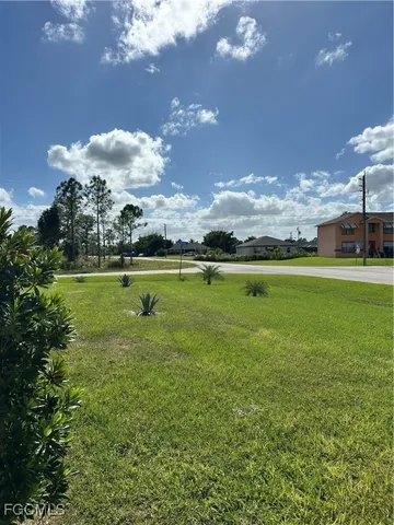 a view of a golf course with a lake